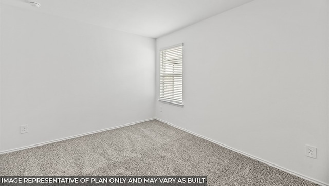 carpeted spare room with baseboards