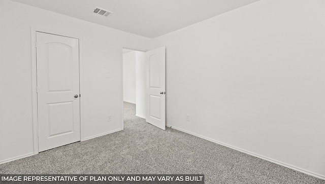 unfurnished bedroom with carpet, visible vents, and baseboards