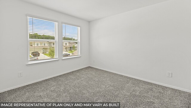 carpeted empty room with baseboards