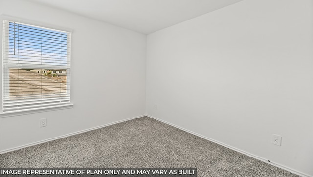 unfurnished room featuring carpet floors and baseboards