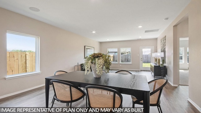 1506 Portia Ct, Conroe, TX 77301 - dining room with wood finished floors, baseboards, and recessed lighting