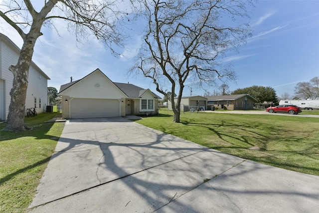 view of front facade with an attached garage, brick siding, driveway, and a front yard