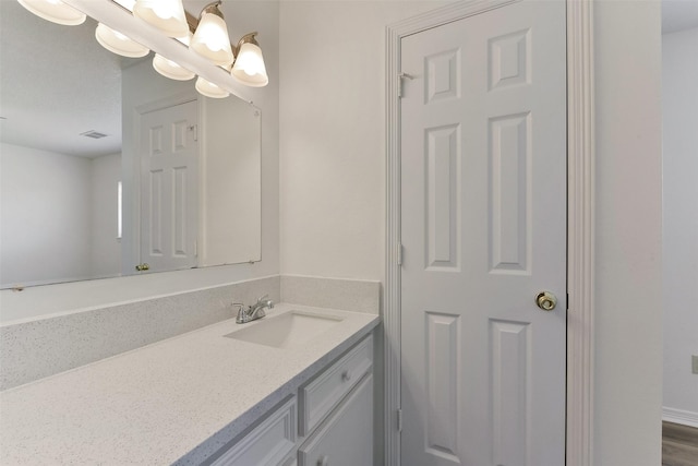 bathroom featuring visible vents and vanity