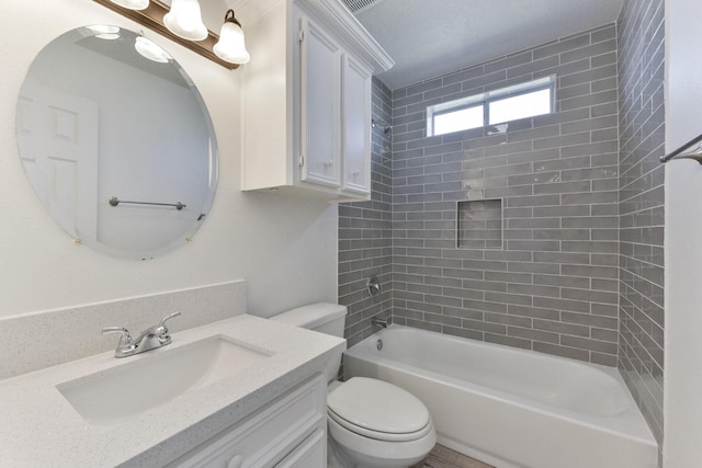 full bath featuring toilet, tub / shower combination, and vanity