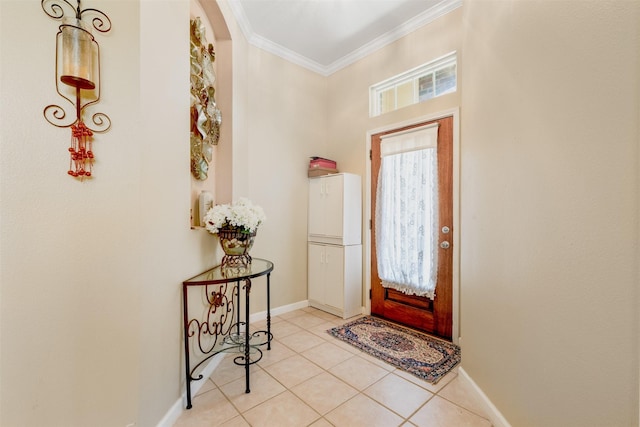 entrance foyer with ornamental molding, light tile patterned flooring, and baseboards