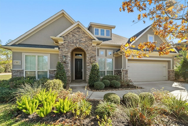 craftsman-style home with stone siding, concrete driveway, and stucco siding