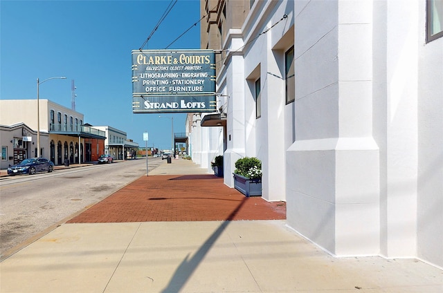 view of street with street lights and sidewalks