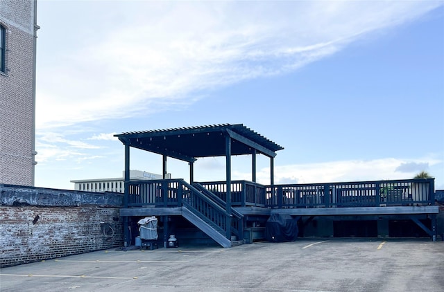 exterior space featuring a deck and a pergola