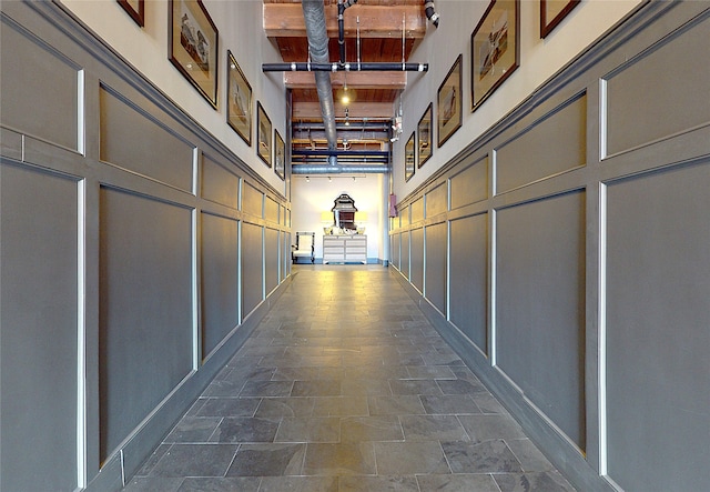 hall with a decorative wall and a towering ceiling