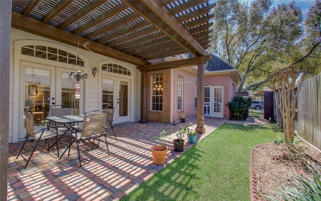 view of patio / terrace with french doors, fence, outdoor dining area, and a pergola