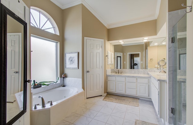 bathroom with ornamental molding, a garden tub, marble finish floor, vanity, and a shower stall