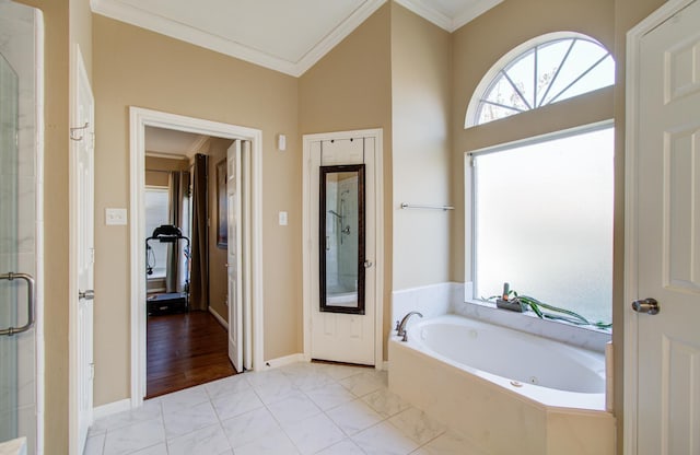 full bath with ornamental molding, a stall shower, baseboards, and a bath