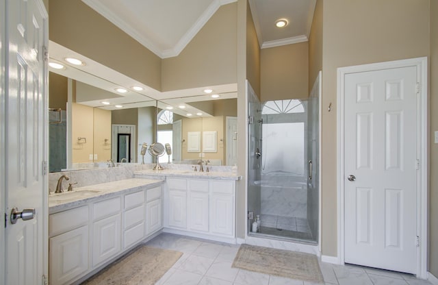 bathroom with ornamental molding, a sink, and a shower stall