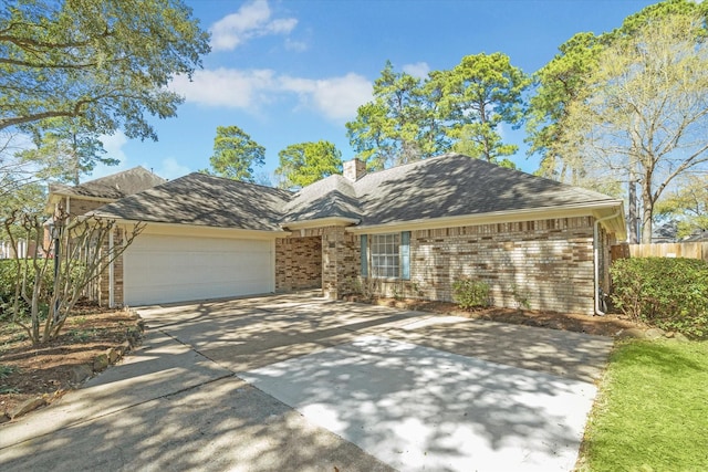 ranch-style home with brick siding, a chimney, concrete driveway, fence, and a garage