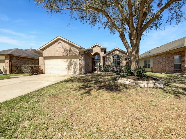 ranch-style house featuring brick siding, an attached garage, and driveway