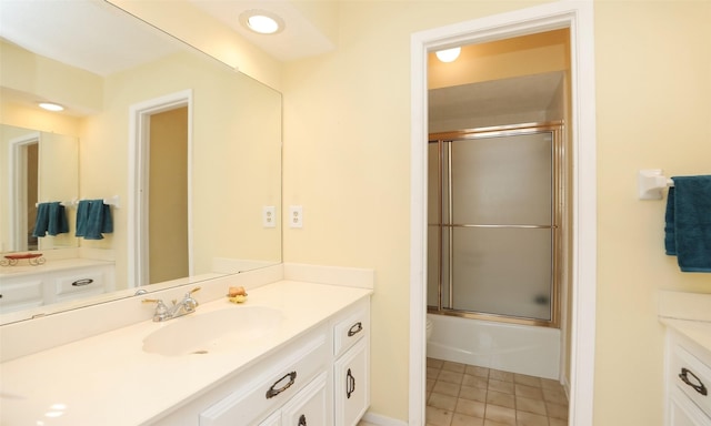 full bathroom featuring tile patterned floors and vanity