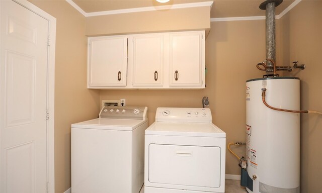 clothes washing area with cabinet space, washing machine and dryer, crown molding, and gas water heater