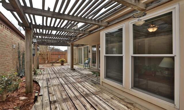 deck featuring fence and a pergola