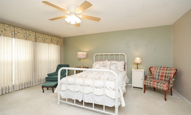 carpeted bedroom with a ceiling fan