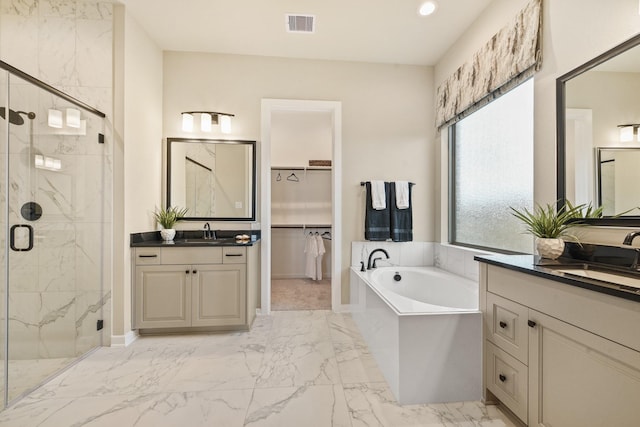 full bathroom with visible vents, marble finish floor, a sink, and a marble finish shower