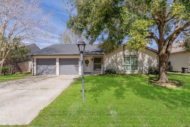 view of front of house with a garage, concrete driveway, and a front lawn