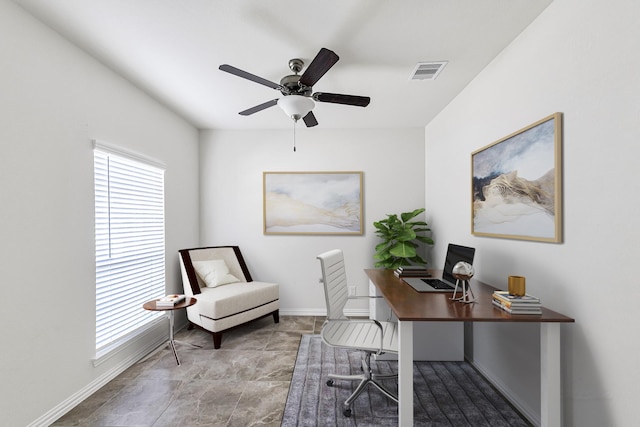 home office featuring baseboards, visible vents, and a ceiling fan