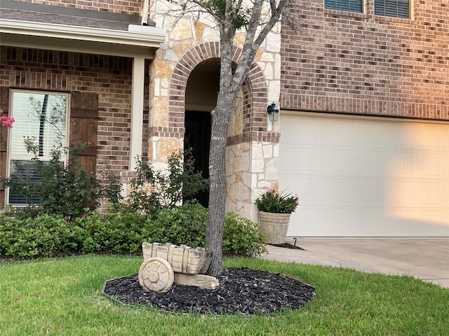 view of exterior entry with stone siding and brick siding