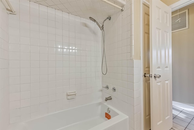 bathroom featuring shower / bath combination and visible vents