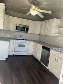 kitchen with open shelves, dark wood-style flooring, ceiling fan, white cabinets, and appliances with stainless steel finishes