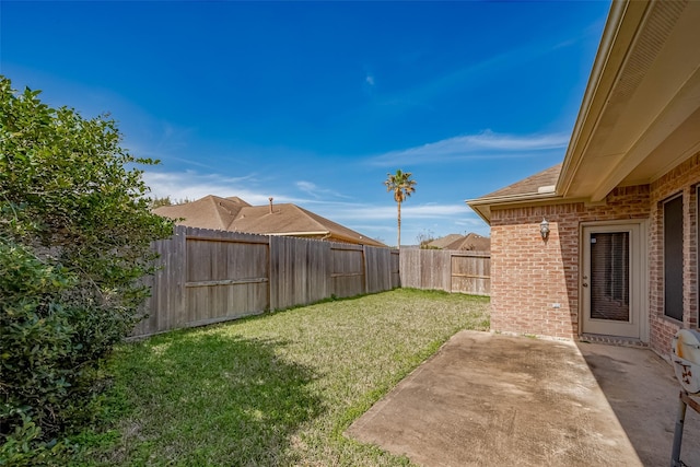 view of yard featuring a patio and a fenced backyard