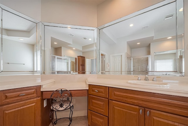 full bathroom featuring visible vents, a stall shower, and vanity