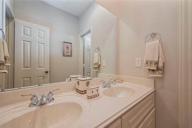 full bath featuring double vanity and a sink