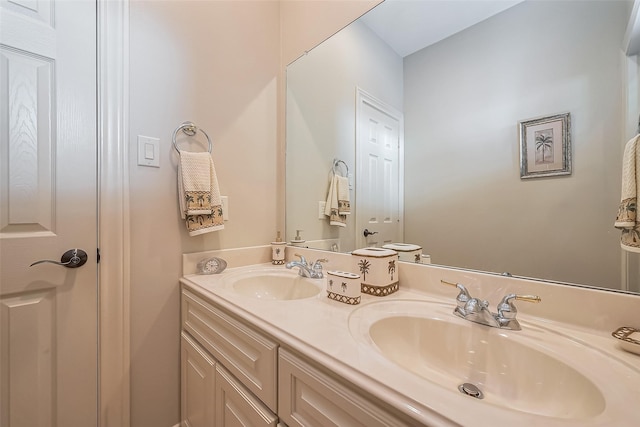 bathroom featuring double vanity and a sink