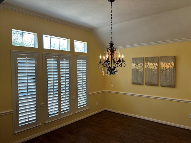 spare room with a chandelier, lofted ceiling, baseboards, ornamental molding, and hardwood / wood-style floors