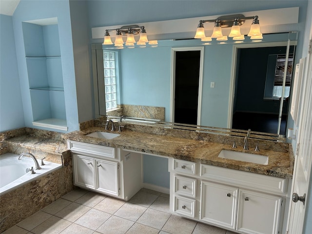 bathroom with double vanity, tile patterned flooring, a sink, and a bath