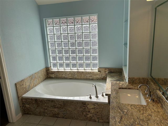 full bath with vanity, tile patterned flooring, and a bath