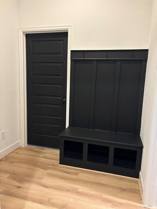 mudroom with baseboards and light wood-style floors