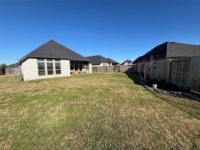 view of yard with a fenced backyard