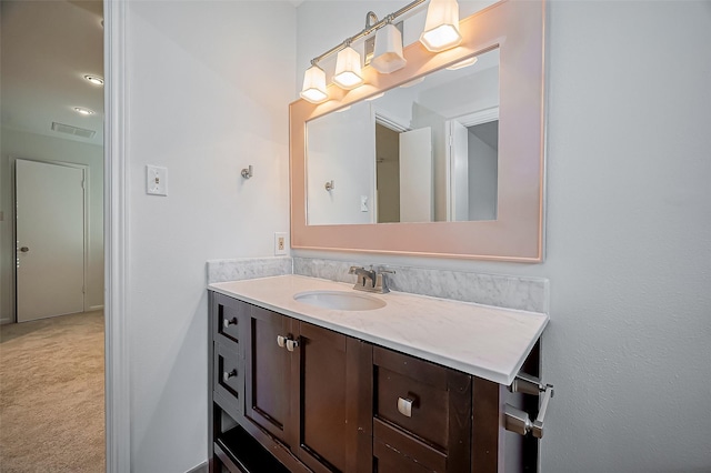 bathroom with vanity and visible vents