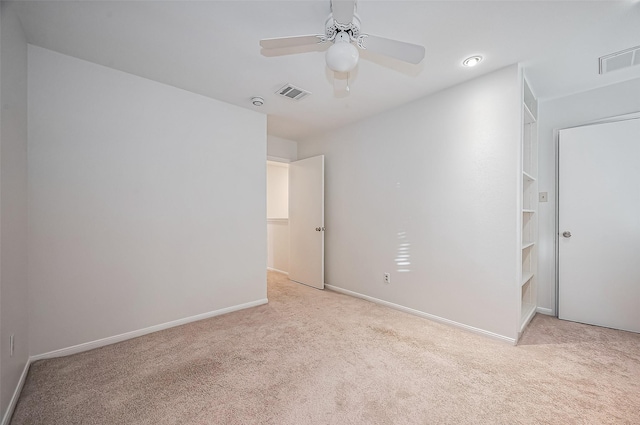 unfurnished bedroom featuring visible vents, ceiling fan, baseboards, and carpet