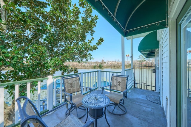 balcony featuring a water view