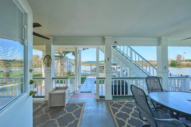 sunroom / solarium with a water view