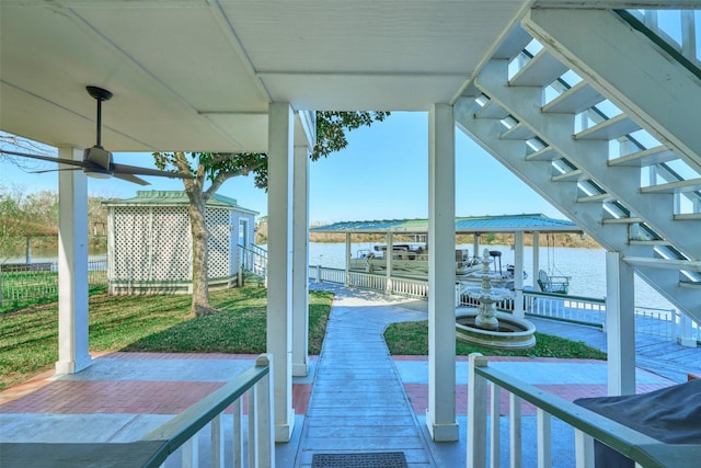 view of patio with a water view