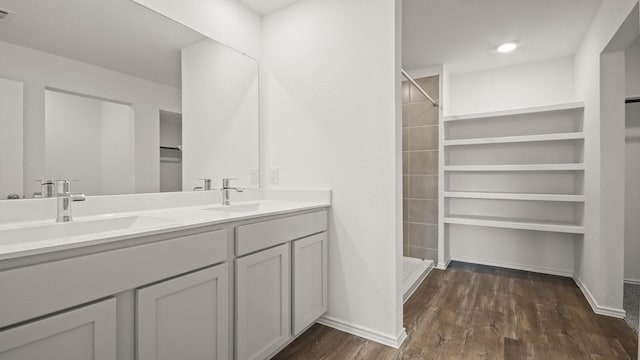 1658 Portia Ln, Conroe, TX 77301 - full bath with wood finished floors, double vanity, tiled shower, and baseboards