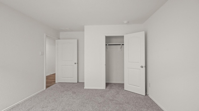 1658 Portia Ln, Conroe, TX 77301 - unfurnished bedroom with carpet flooring, a closet, and baseboards