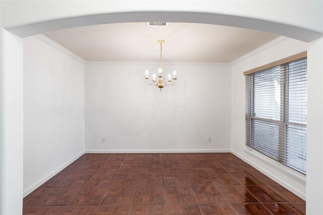 unfurnished room featuring visible vents, arched walkways, a chandelier, and crown molding