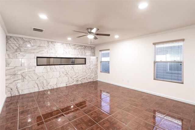 unfurnished living room with visible vents, baseboards, ceiling fan, ornamental molding, and recessed lighting