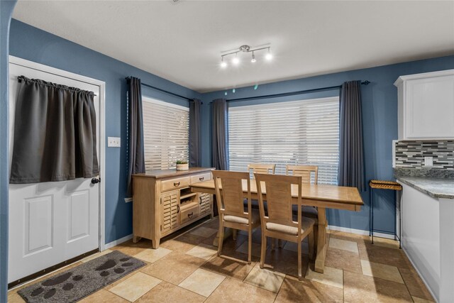 dining room featuring baseboards