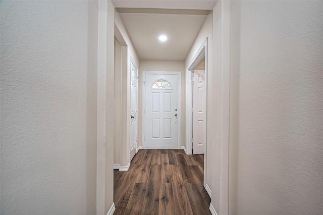 19430 Mystic Cypress Dr, Katy, TX 77449 - corridor with baseboards, a textured wall, dark wood-style floors, and recessed lighting