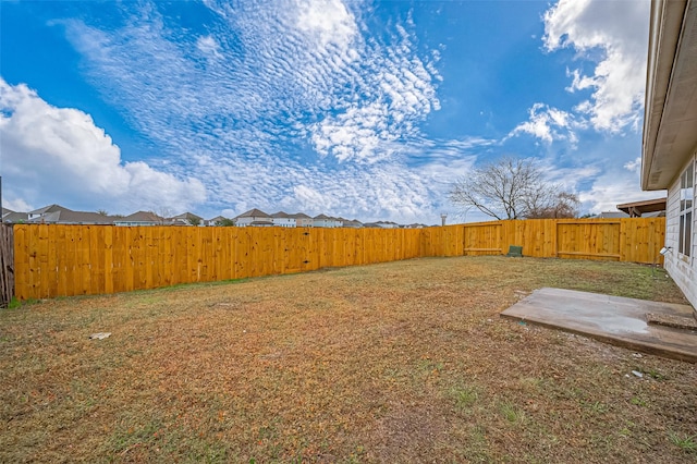 view of yard with a fenced backyard